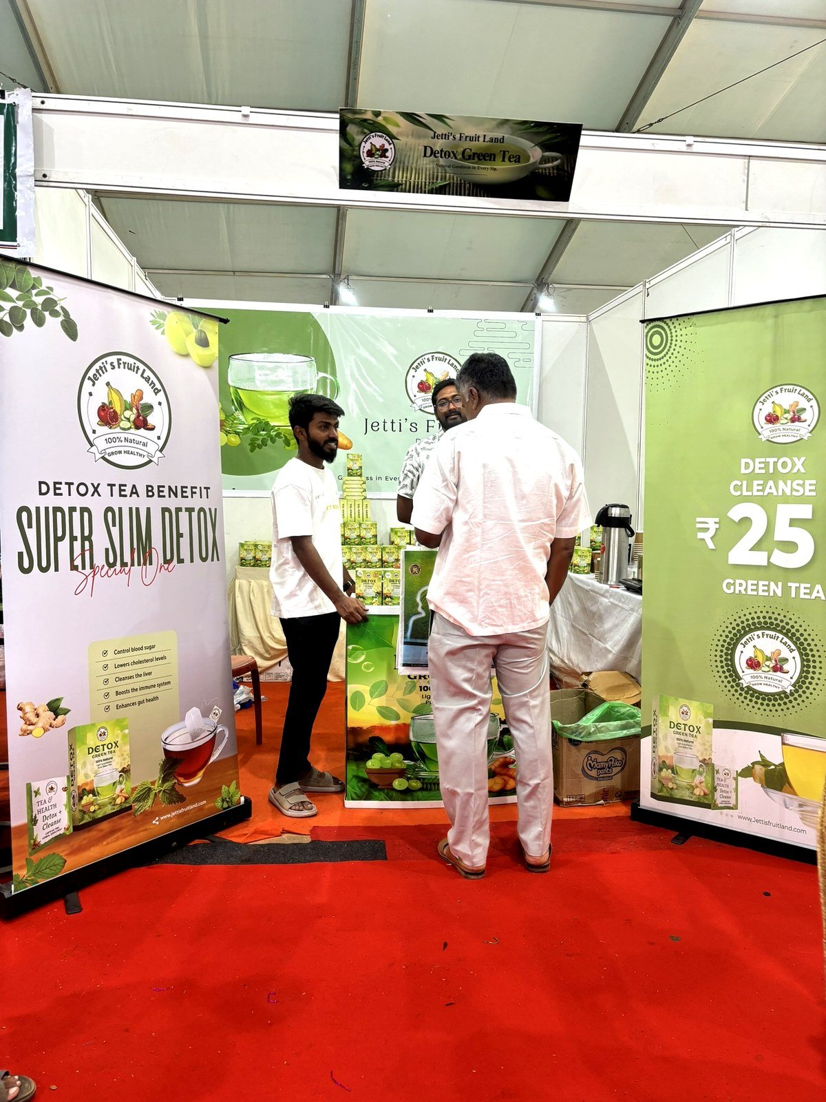 Team engaging with customer at Jetti's Fruit Land stall